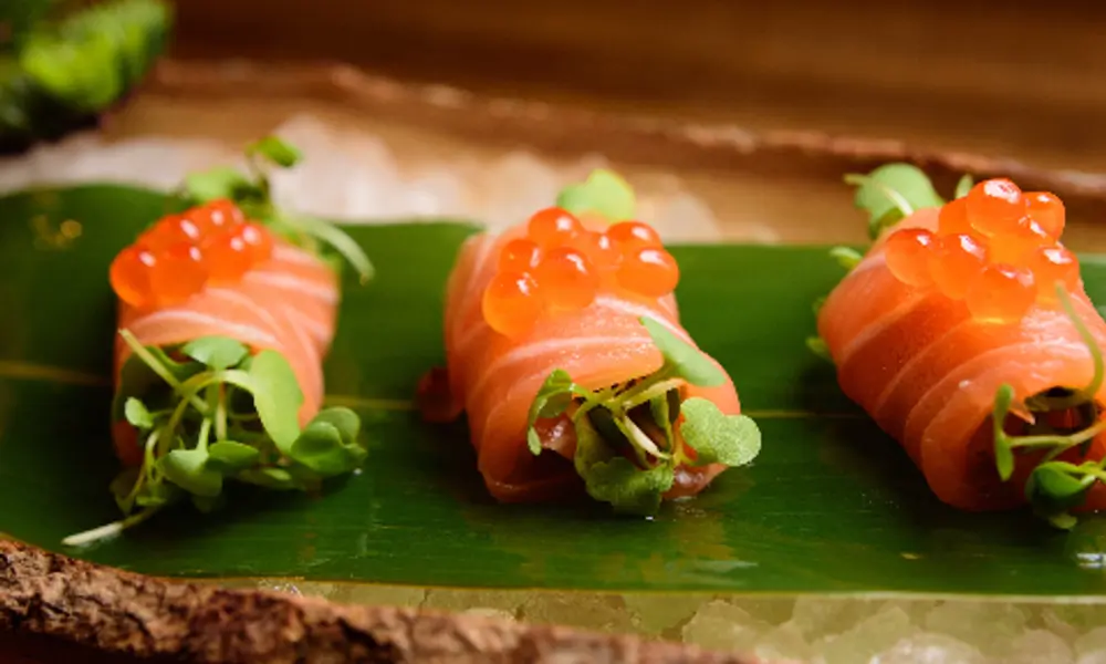 Salmon rolls topped with roe at Sushi Infinity, a Japanese Restaurant in Halifax